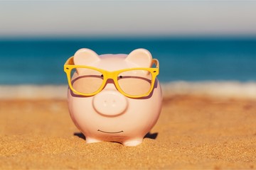 Summer piggy bank with sunglasses