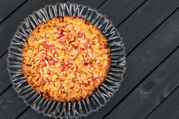Homemade apple pie on wooden background. Place for text. Top view.