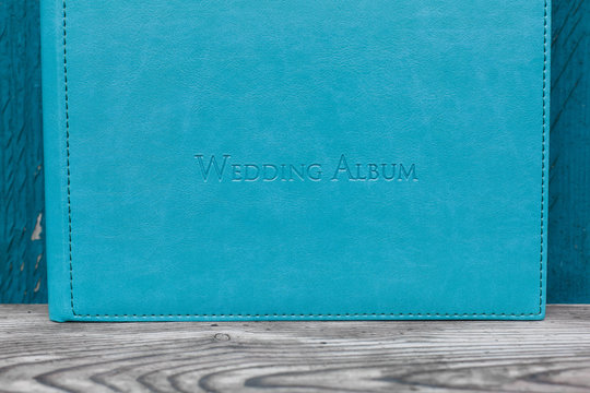 photobook with leather cover.
Photo book on a bright background.
wedding album
Photo album on a wooden surface.
