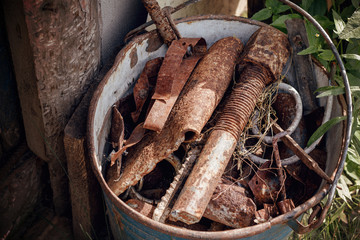 waste iron metals rusted in bucket