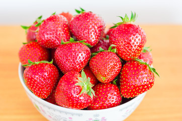 Ripe strawberries in a bowl.