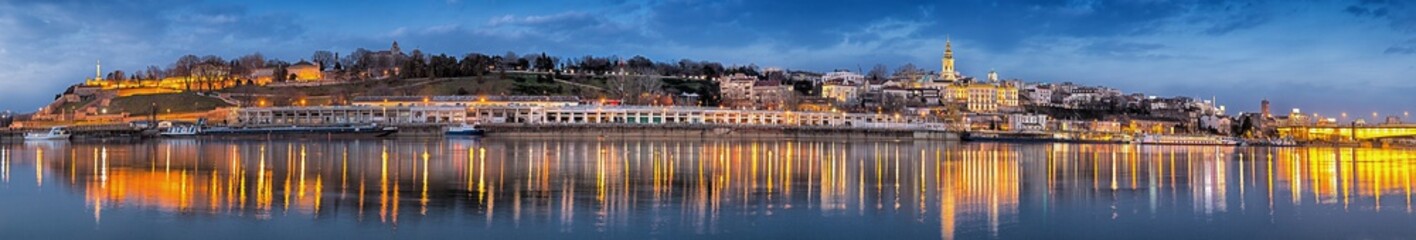 Fototapeta premium Belgrade, Serbia landmarks and symbols, Kalemegdan, Usce, Sava river, Cathedral, St. Sava Temple, Belgrade Lady Building, Old City, Branco’s Bridge, by night with city lights and water reflections