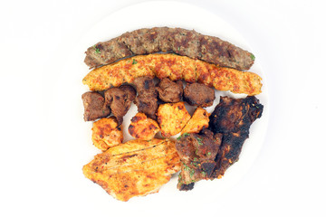 Mixed charcoal grilled platter chicken beef mutton goat meat shish kebab tawook middle east Arab