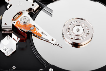Hard drive isolated on white background. HDD. Major components of a 3.5-inch SATA hard disk drive:...