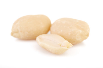 Peeled peanuts on a white background. Healthy food. Nuts.