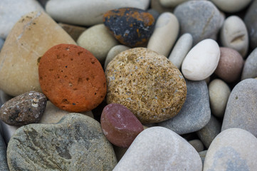 boulders and colorful pebbles on the beach