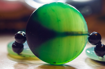 Large polished beads of beautiful translucent green agate gemstone, macro
