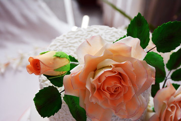 Big white wedding cake with peach flowers