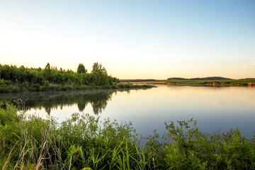 Summer sunny landscape. Morning, dawn on the lake. Saratov Region, Russia.