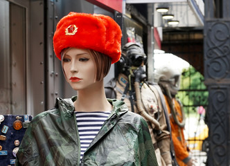 Female mannequin in a souvenir red Russian military cap.