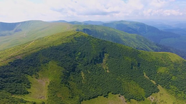 Aerial shot of a pyramidal peak with obtuse angles in the Carpathians in summer