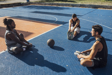 Basketball Players Stretching on the Court