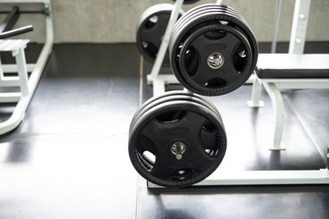 Fototapeta premium Black dumbbell set in gym. fitness and healthy lifestyle concept.