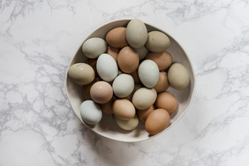 Bowl of fresh, colorful eggs