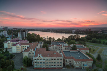 Aerial view in Ivano - frankivsk city,lake and school at sunset