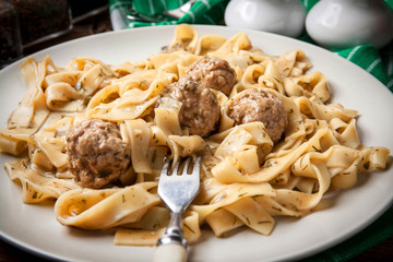 Tagliatelle pasta with beef meatballs.