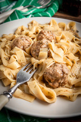 Tagliatelle pasta with beef meatballs.