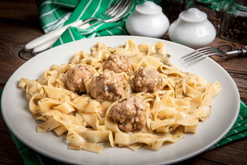 Tagliatelle pasta with beef meatballs.
