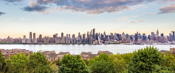 New York City midtown Manhattan skyline panorama view from Boulevard East Old Glory Park over Hudson River.