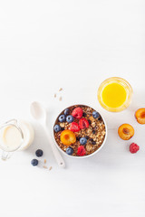 healthy granola for breakfast with berry fruit nut, vegan milk