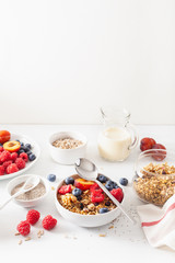 healthy granola for breakfast with berry fruit nut, vegan milk