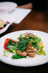 Perilla, Tul-kkae or beefsteak leaves salad with grilled pork Bulgogi. Korean food