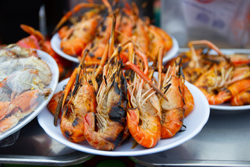 Grilled shrimps seafood on the table in market of Bangkok Thailand 