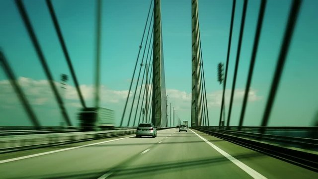 Bridge between Sweden and Denmark. &Ouml;resundsbron. View from passenger seat of car. Timelapse.