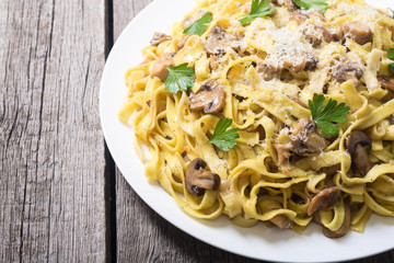 Pasta tagliatelle with chicken meat and mushroom
