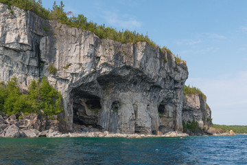 Bright beautiful landscape of Niagara Escarpment limestone cliffs along lake huron