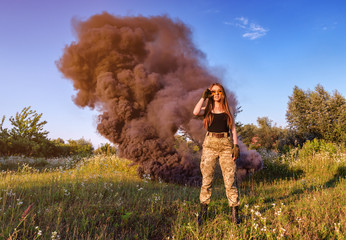 girl on the background of black smoke