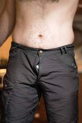Man in shorts with open zip fly. Panties out. vertical format