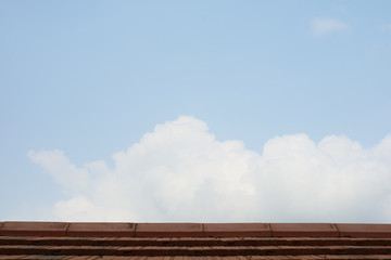 top roof and heap white cloud and fresh blue sky
