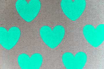 Obraz premium cardboard or carton with cyan hearts