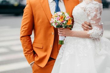 People, love, relationships and wedding ceremony concept. Unrecognizable groom and bride in festive...