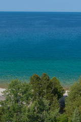 Bright beautiful landscape of Niagara Escarpment limestone cliffs along lake huron