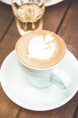 Hot coffee ready to drink on wood table background