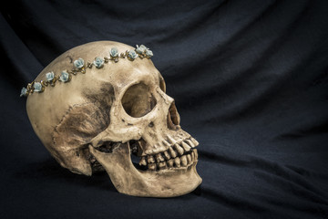 Still life with a human skull with the old, in with the diamond and jewelry