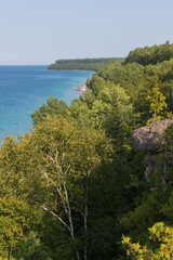 Bright beautiful landscape of Niagara Escarpment limestone cliffs along lake huron