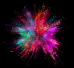 Coloured powder explosion isolated on black background