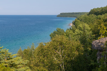Bright beautiful landscape of Niagara Escarpment limestone cliffs along lake huron