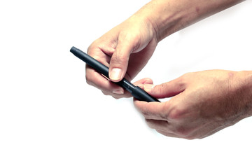 hand of a man holding a pen with removing a pen's cover action on white background isolated