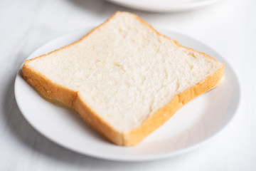 Sliced bread on white plate