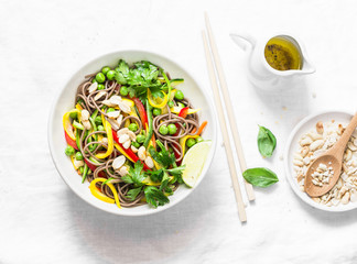 Pad Thai vegetables soba noodles on light background, top view. Healthy vegetarian food in asian style