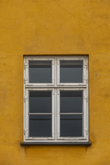 Fototapeta na wymiar Window on the colorful facade