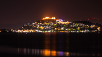 Fototapeta na wymiar Night scene of Astros town with old castle Greece