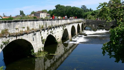 Brantôme crowned bridge on the river Dronne, Dordogne, France 
