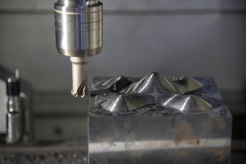 The CNC milling machine cutting the mold part in roughing   process with the index-able radius ...