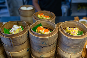 Variety of dim sum steamed in bamboo basket. Chinese breakfast style in southern of Thailand.