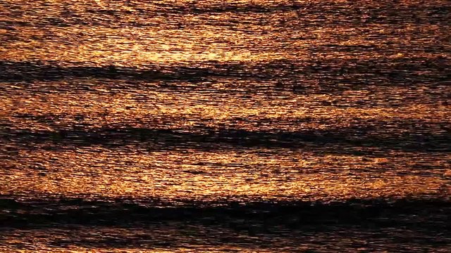 Sunrise light reflection over the waves of black sea near Atliman Kiten Bulgaria